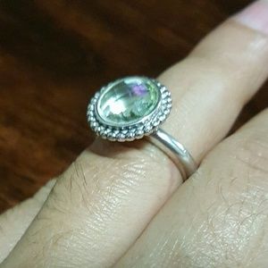 Pandora authentic ring with light green stone.
